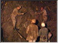 Stemming shotholes before blasting
