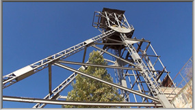 The surviving steel headframe at El Cobre mine.