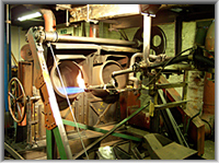 Bluing tacks in rotating barrels heated by fierce gas jets