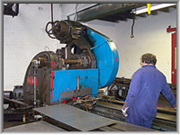 Cutting nail and tack strips from sheet steel