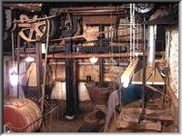 The line shafts, drive belts and pulleys of the water powered machinery.
