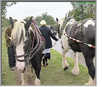 Two horse drawn canal boats passing each other