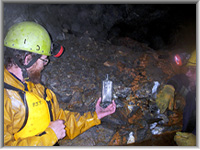 Paul Thorne & Chris Andrews examining old bottles on the 120m level