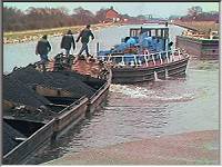 Puddings and tug leaving Syke House Lock